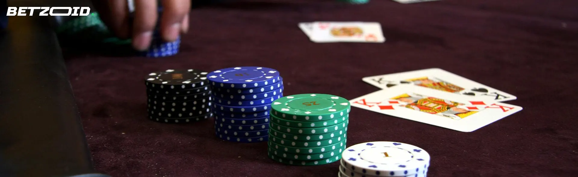 Stacks of playing chips of different colors on the game table.