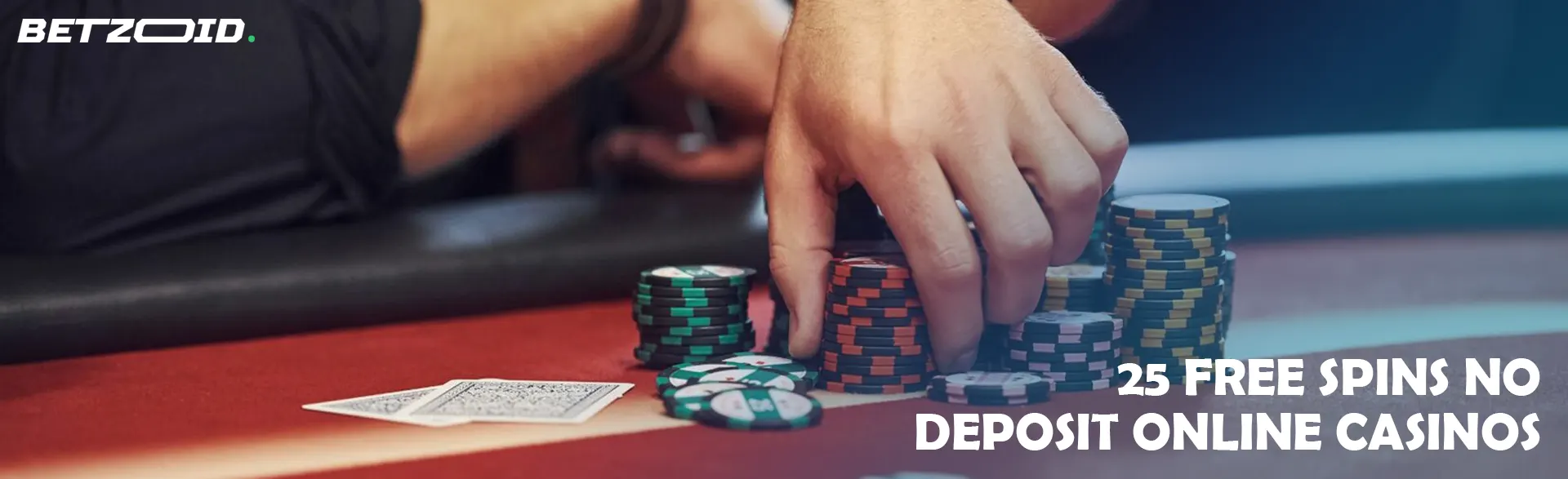 A player holds chips on a casino table.