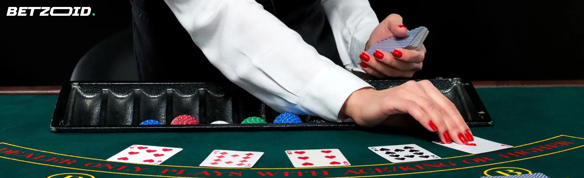 Croupier deals cards on a green casino table.