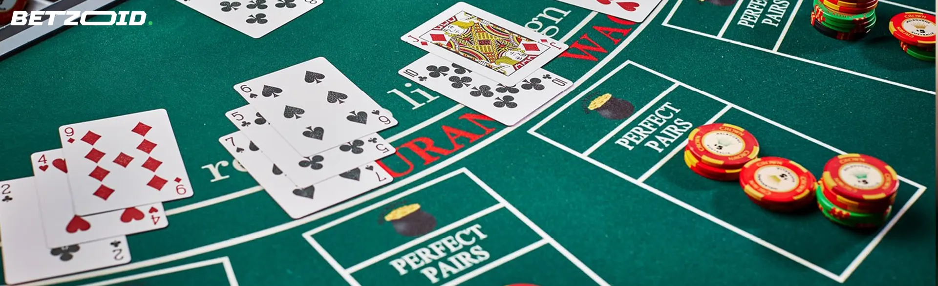 Casino table with cards and chips.