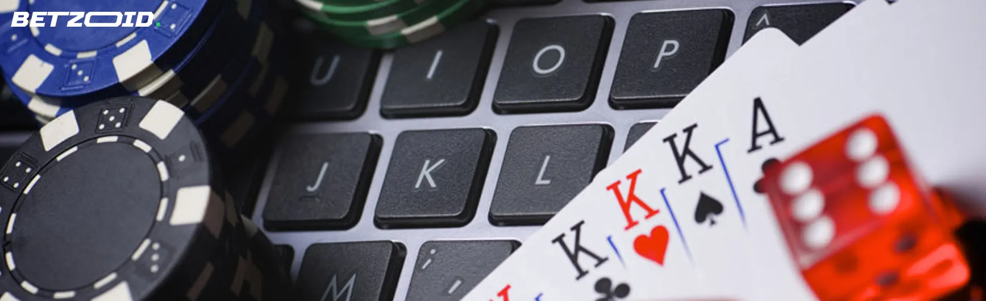 Playing cards, dice and chips on the keyboard.