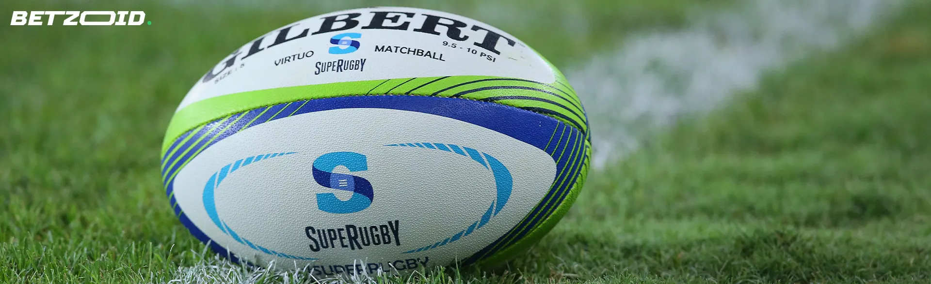 Rugby ball lying on the grass.