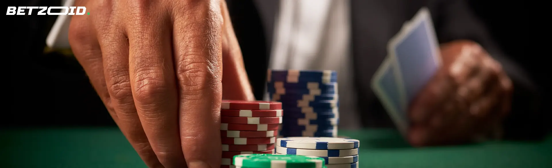 The player puts casino chips in front of him.