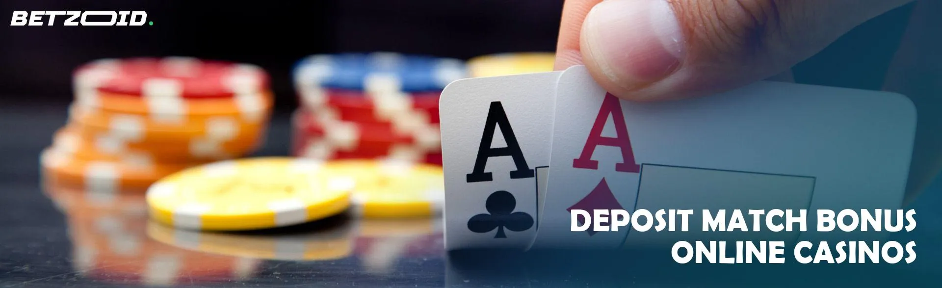 The player holds the cards next to the casino chips.