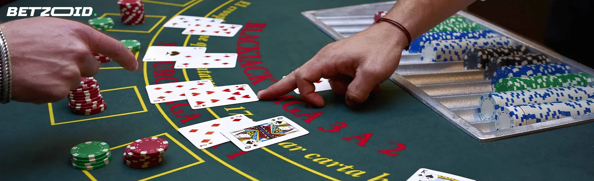 The player points to the cards on the casino table.