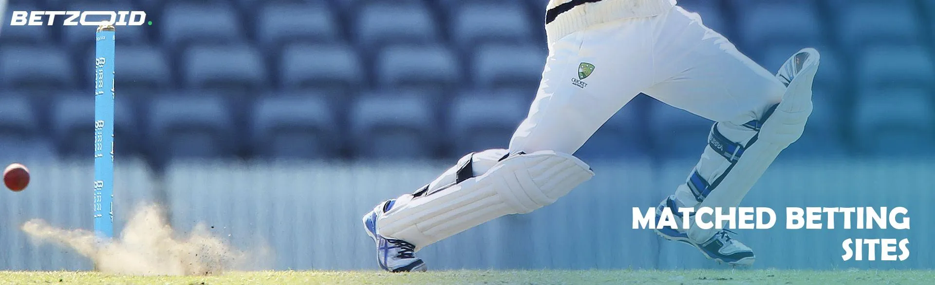 A cricketer is hitting the ball.