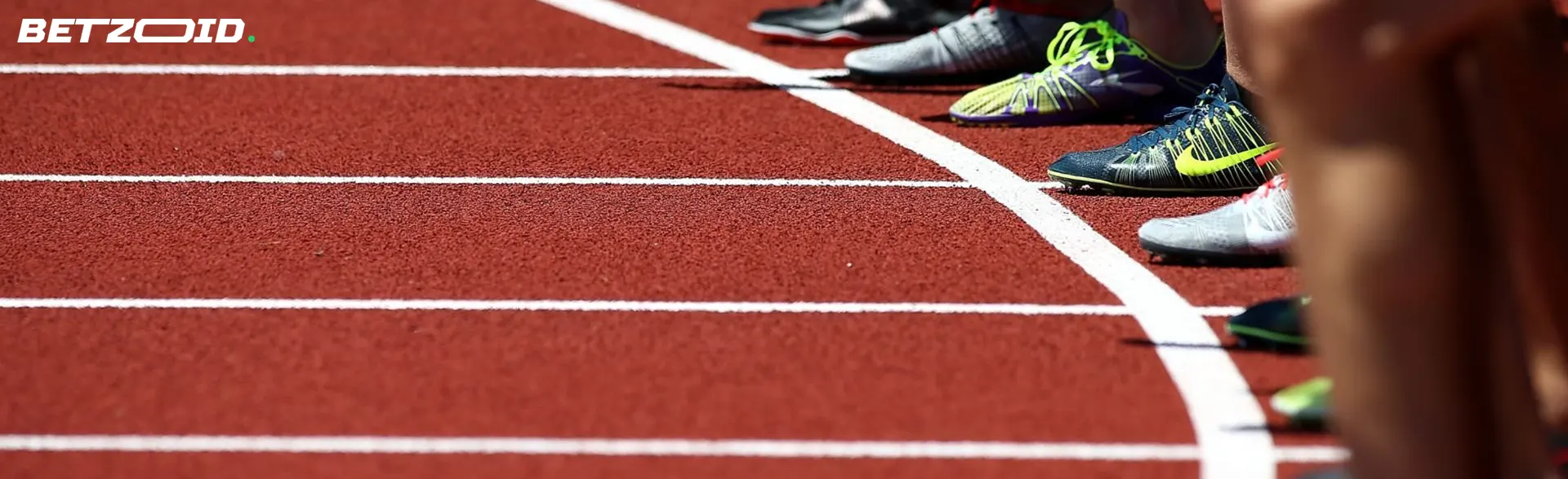 Athletes on the starting line of the running track.