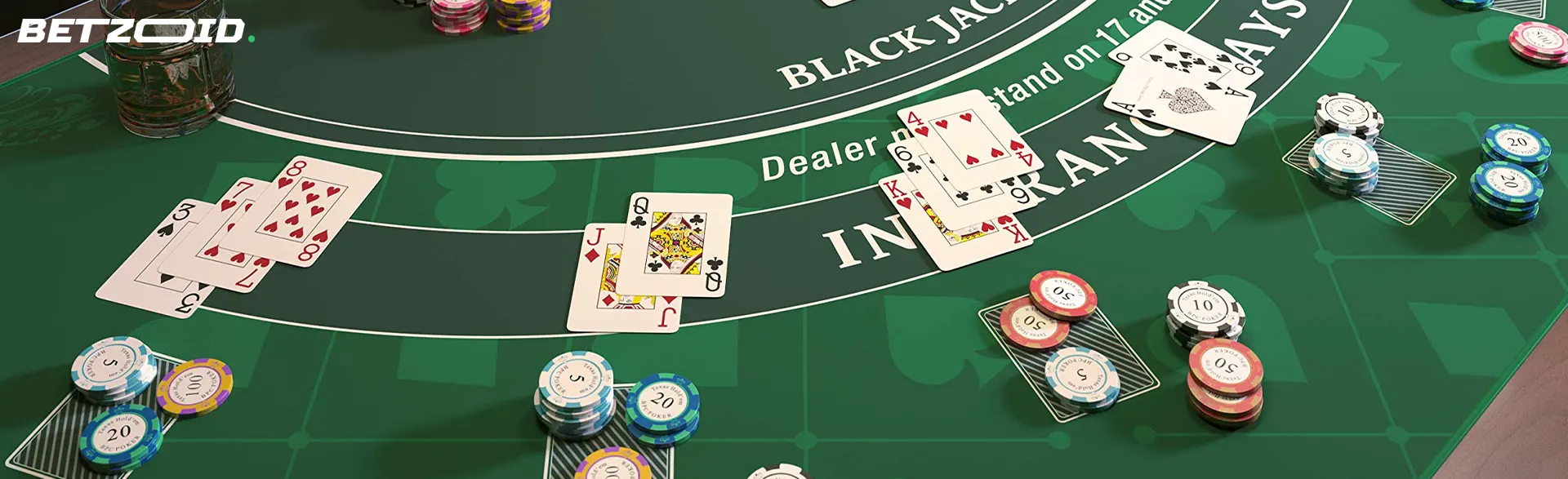 Blackjack table with cards and chips.