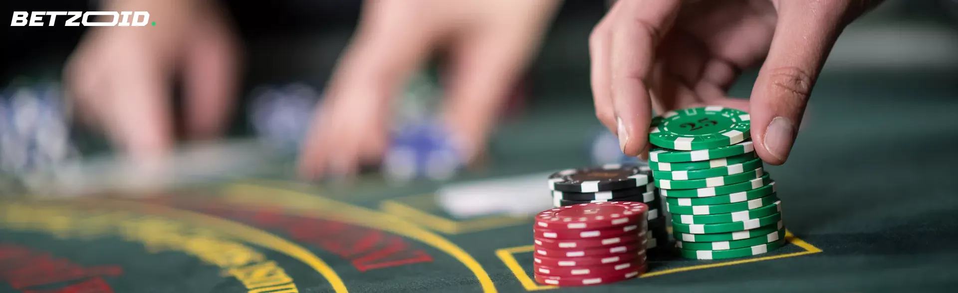 A player places chips on the casino table.