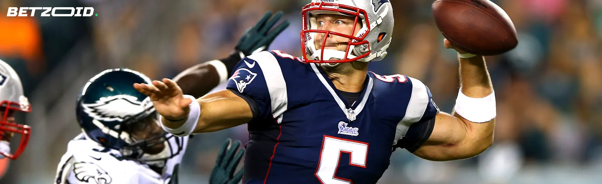 American football player with the ball during the game.