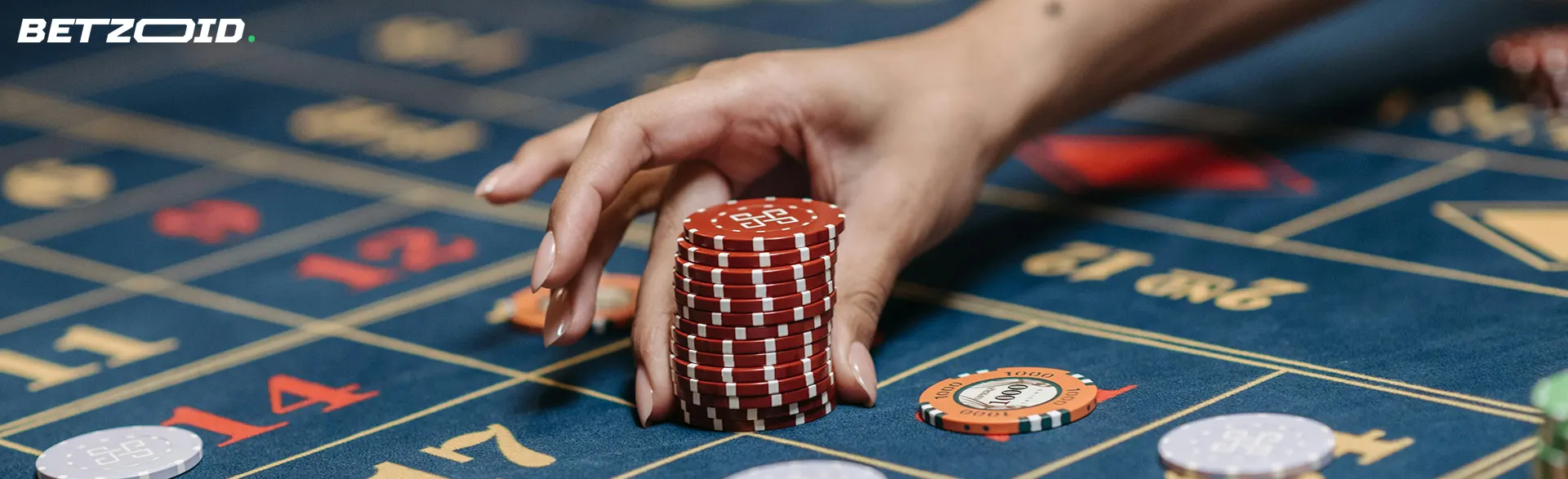 The player places a stack of chips on the casino table.