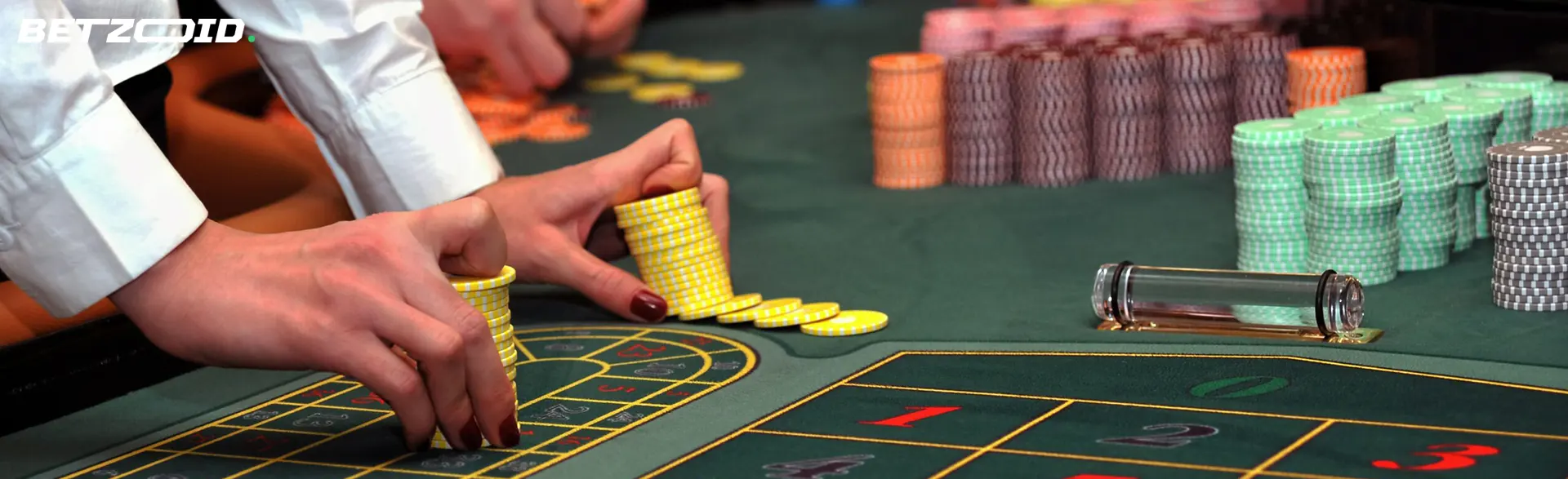 The player places chips on the roulette table.